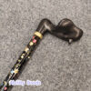 beautiful gold collar attaching handle to stick